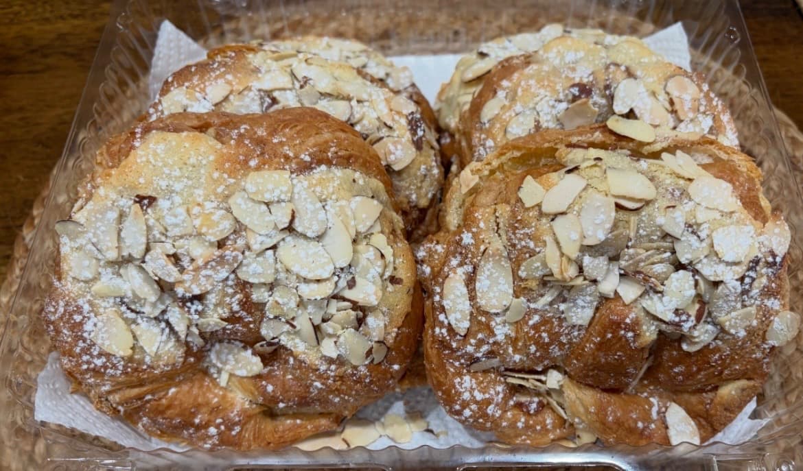 Almond croissants dusted with powdered sugar