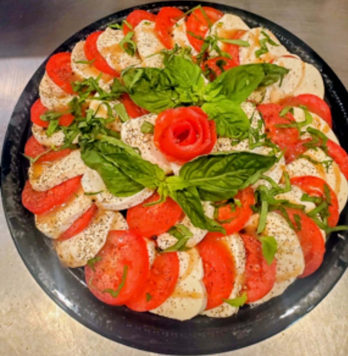 Caprese salad with mozzarella, tomato and basil