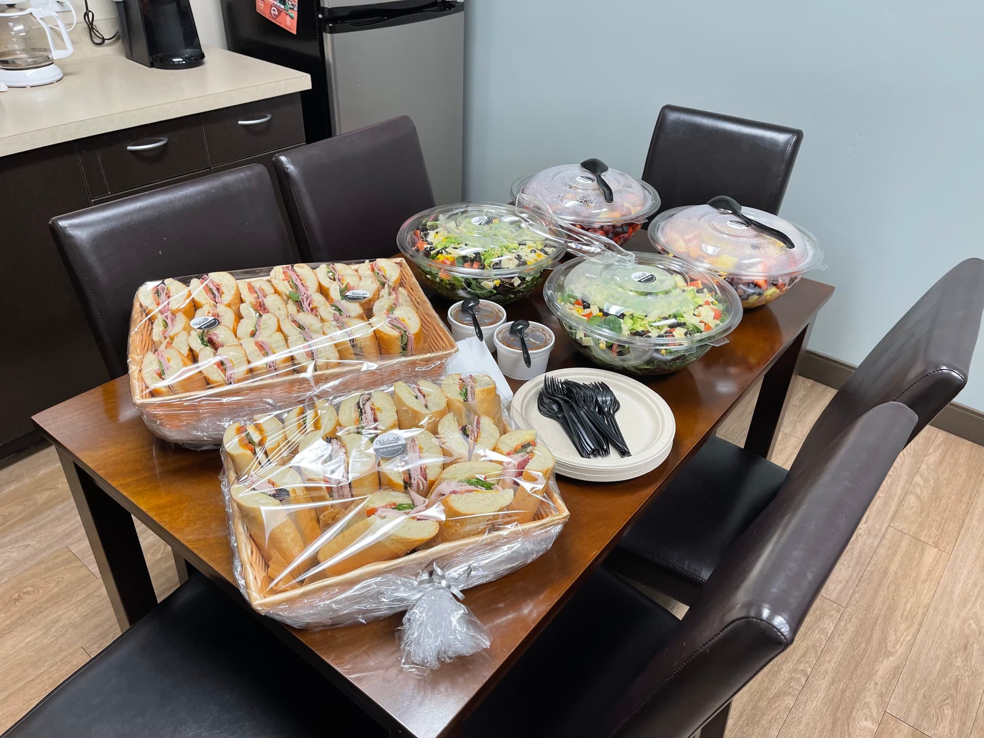 Corporate lunch delivery laid out on a conference table